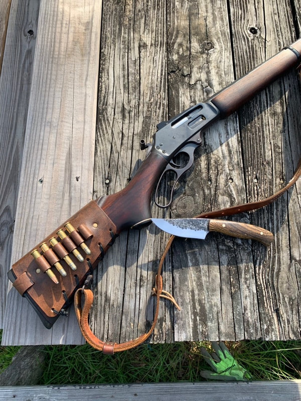 Marlin 336 lever action with Antique Crown Cartridge Cuff buttstock shell holder and leather rifle sling