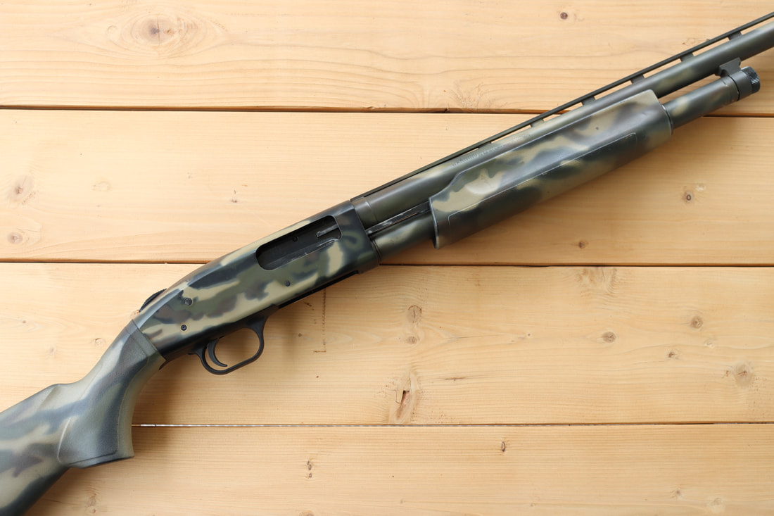 My first gun: Mossberg 500 12 gauge in woodland camo